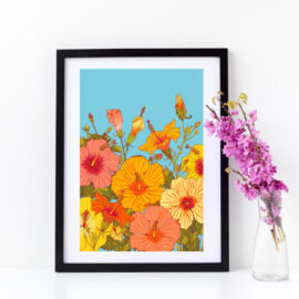 Hibiscus flowers print in oranges, yellows, pinks on powder blue